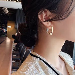 Modern gold tone square earrings